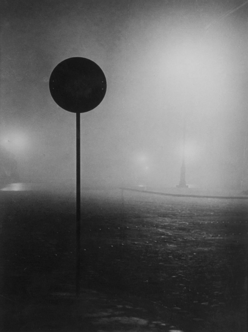 Brassai (1899-1984) - Denfert Rochereau in The Fog,: Gelatin silver ferrotyped print, printed ca.1945, signed, titled, dated and annotated in ink and pencil with various photographer's stamps and estate stamp verso, 29 x 22cm (11 3/8 x 8 5/8in)