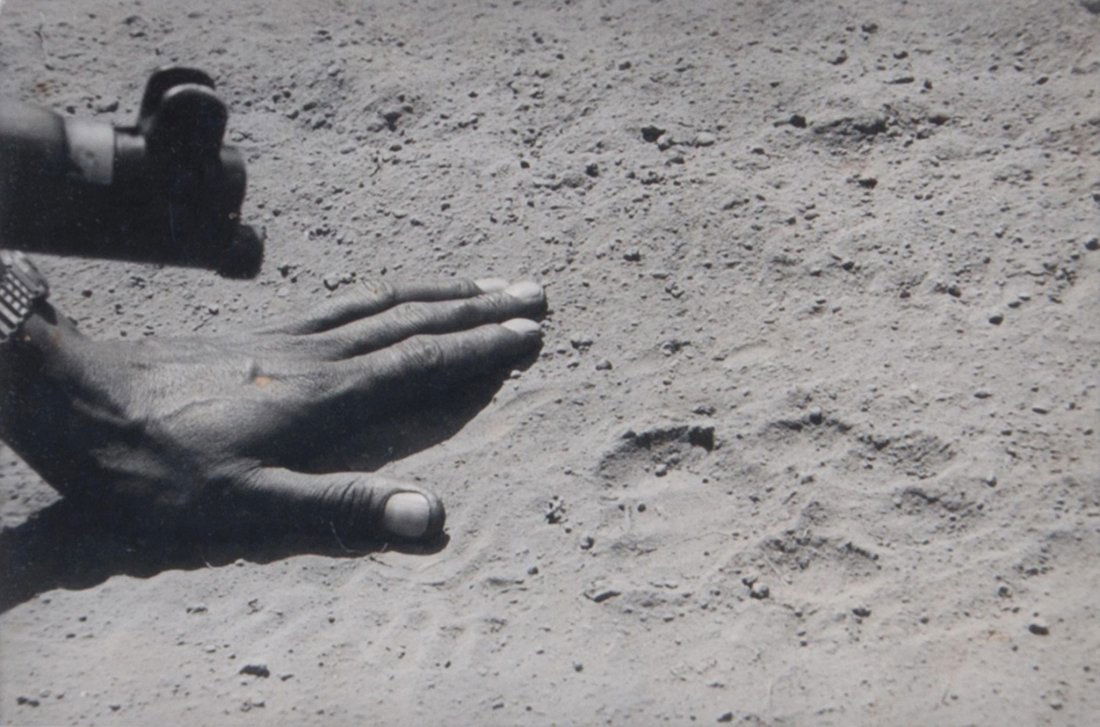 Peter Beard (b.1938) - Man's Hand and Lion Paw Mark,: Gelatin silver print, titled in blue ink with newspaper cutting affixed to verso along with notebook remnants, 11 x 16.5cm (4 3/8 x 6 1/2in) IMPORTANT: This lot is sold subject to Artists Resale Right