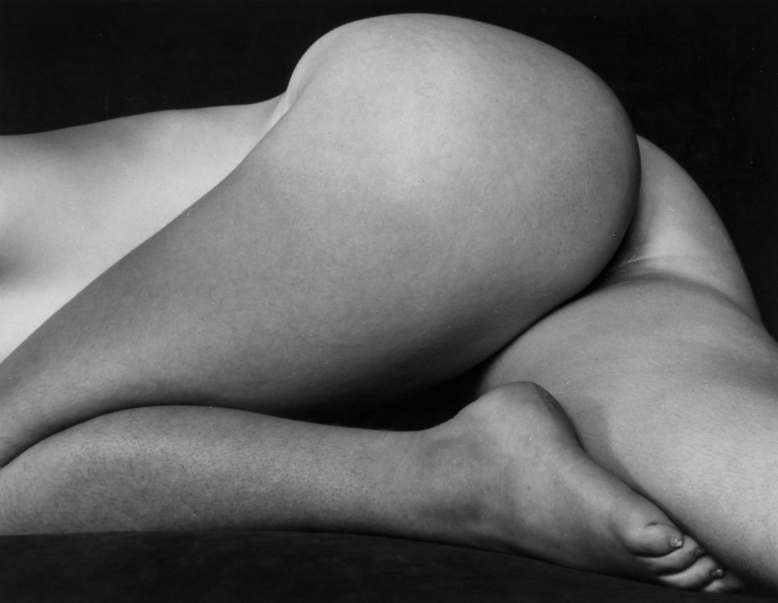 Edward Weston (1886-1958) - Nude, 1934: Gelatin silver print, printed later by Cole Weston, signed and annotated by Cole Weston in pencil with Negative by Edward Weston stamp on mount verso, 9 x 11.7cm (3 1/2 x 4 5/8in) ** This lot has been