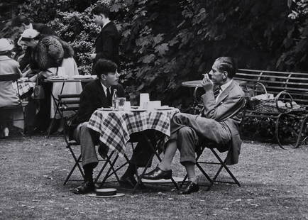 Thurston Hopkins (1913-2014) - A Harrow Boy With His: Gelatin silver print, printed later, titled, dated and annotated in pencil in unknown hand with 'B.B.C. Publications' and 'Radio Times Hulton Picture Library' stamps and label affixed verso, 24.8 x 35