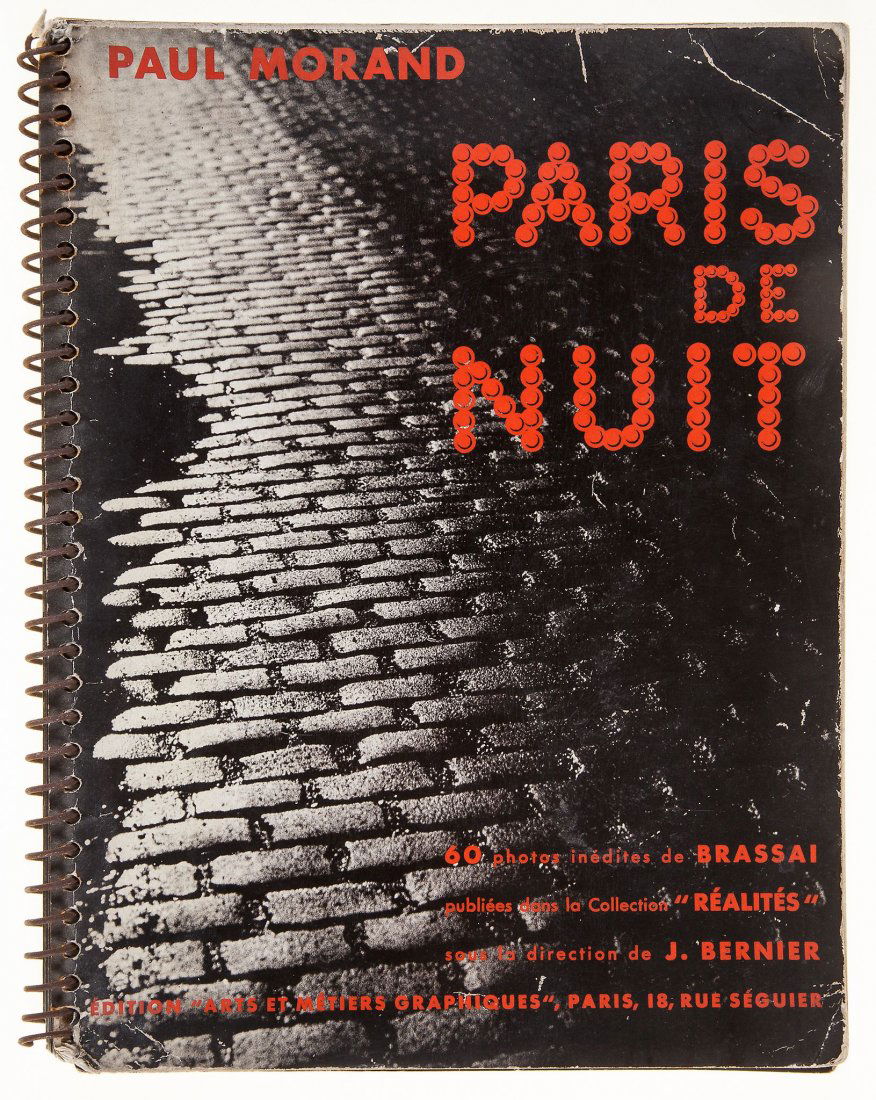 Brassaï (1899-1984) - Paris de Nuit, 1933: Arts et Métiers Graphiques, Paris, first edition, 60 monochrome photographs by Brassai, original spiral-bound card pictorial wrappers lettered in red, 4to Literature: Parr, M. & Badger, The Photo