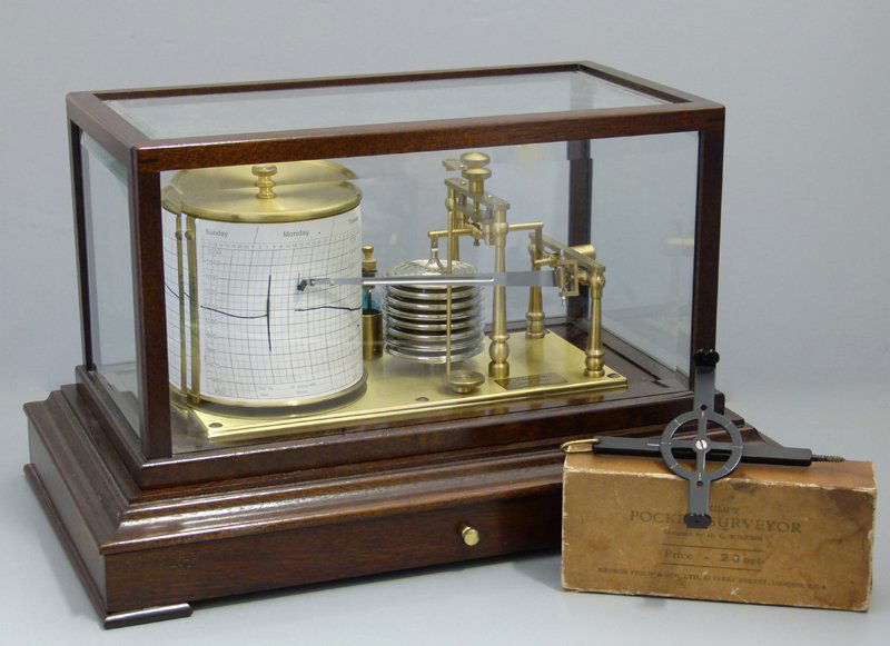 Comitti & Son (London) barograph and Philips: Mahogany cased barograph labelled Comitti & Sons, London, the aneroid of eight bellows, in a bevelled glass case, length 36cm; also a Philip's Pocket Surveyor, boxed with instructions dated 1933. (2)