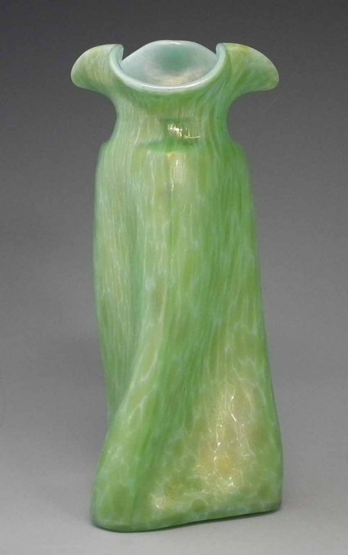 Loetz Papillon vase after the design of Christopher: Loetz Papillon vase after the design of Christopher Dresser, with green splashed opalescent body, 24.5cm high Condition report: No chips or damages.