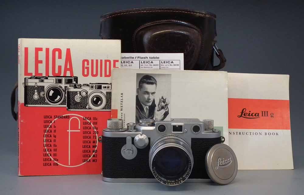 Leica IIIF Red Dial camera serial number 773529,: Leica IIIF Red Dial camera serial number 773529, fitted with Summarit f = 5cm 1:15 lens Number 1297363, UVa filter and lens cap, together with leather ever- ready case, two instruction books and a Lei