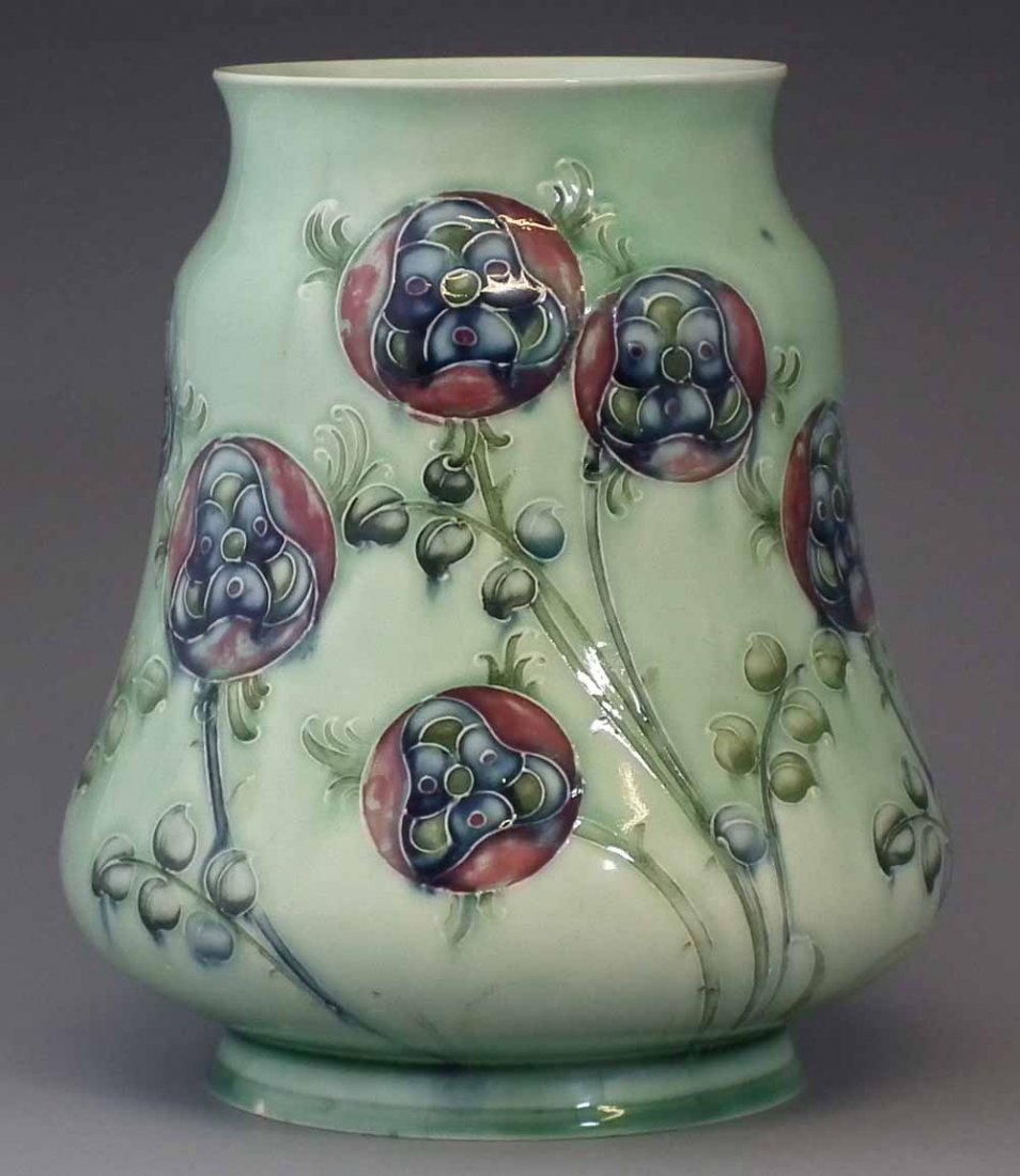 Moorcroft Liberty & Co. vase circa 1905 decorated: Moorcroft Liberty & Co. vase circa 1905 decorated with Tudor Rose pattern on a pale green ground, printed and painted marks to base, 18.5cm high