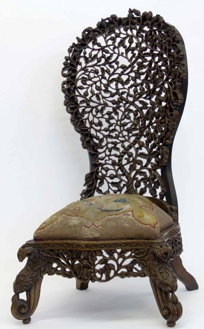 Burmese hardwood spoon back chair, 19th century, carved: Burmese hardwood spoon back chair, 19th century, carved with openwork foliage over a wool work seat (fragile)