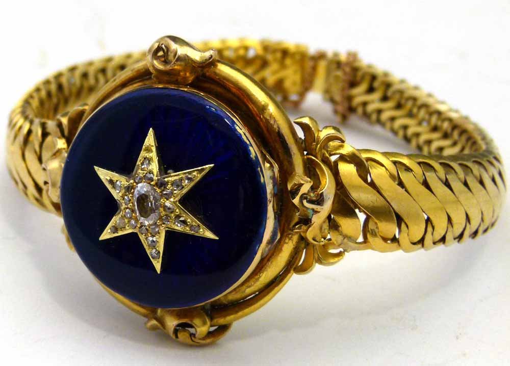 Victorian gold bracelet locket set with diamonds and: Victorian gold bracelet locket set with diamonds and guilloche enamel on the hinged cover, diameter 3cm, gross weight 41.5g. Condition report: scratches and minor chips to the enamel.