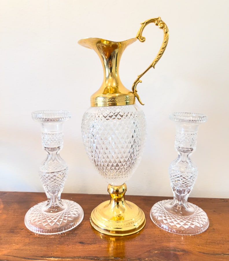 Lot of Cut Glass Ewer Bowl Candlesticks: Brass-tone metal mounted ewer is 13" tall, 5.5" at the widest. The base is slightly damaged and so the ewer does not stand up perfectly straight. Candlesticks are 7.25" tall, the bases are 4" diameter