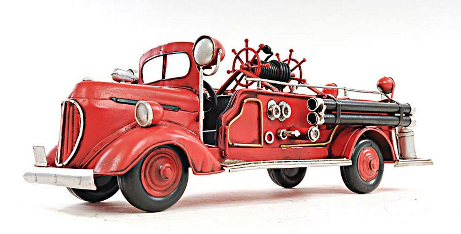 ?RED FIRE ENGINE FORD 1:40-SCALE: ?RED FIRE ENGINE FORD 1:40-SCALE -- Fight the fire with this classic 1938 Ford Fire Engine Truck model. It is made of iron and has a scale of 1:40. It features many intricate details such as fenders w