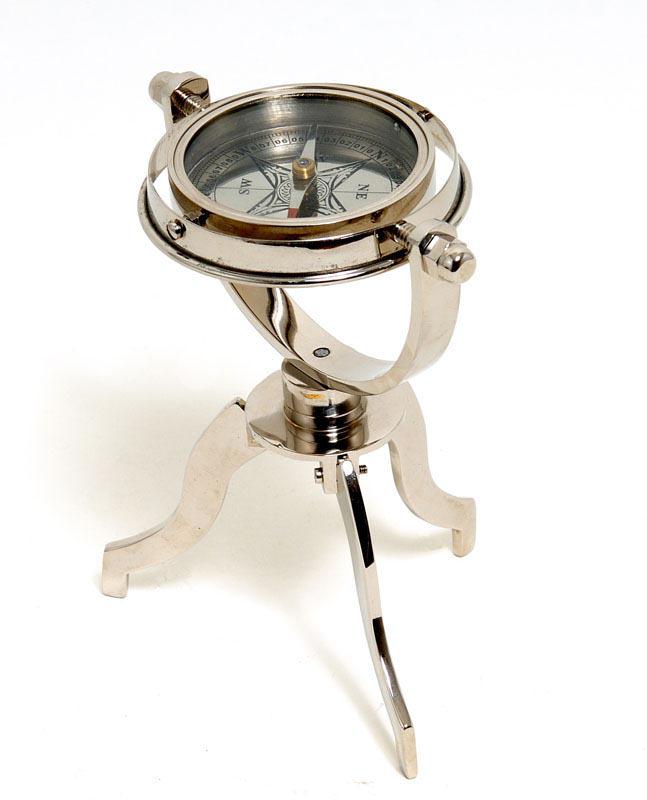 Gimbaled Compass on tristand: Gimbaled Compass on tristand -- This is a fully functional gimbaled compass. It is made of high quality brass with a silver tinted finish. Each component is crafted with the finest craftsmanship. Comp