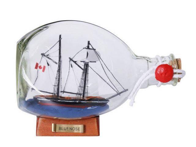 Bluenose Sailboat in a Glass Bottle 7in.: Bluenose Sailboat in a Glass Bottle 7in. -- Weight:?1 LB Box Dimensions:?9in. x 7in. x 7in. (L x W x H) #21ST30007