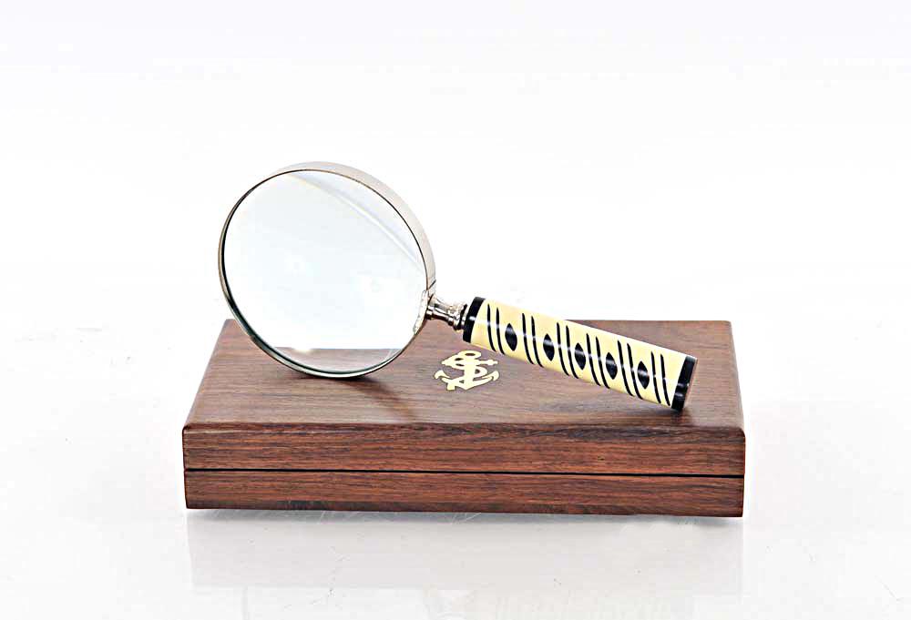Magnifier in wood box- 4 inches: Magnifier in wood box- 4 inches -- This magnifier is made of high quality gold brass. It comes with a beautiful handle. It is of a very appropriate size for use and decorative purposes. It is a great 