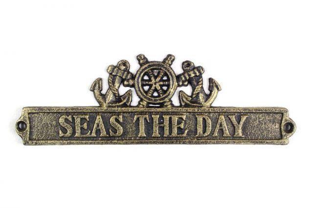 Antique Gold Cast Iron Seas the Day Sign with Ship Whee: Antique Gold Cast Iron Seas the Day Sign with Ship Wheel and Anchors 9in. -- Weight:?4 LB Box Dimensions:?4in. x 14in. x 3in. (L x W x H) #21ST29700