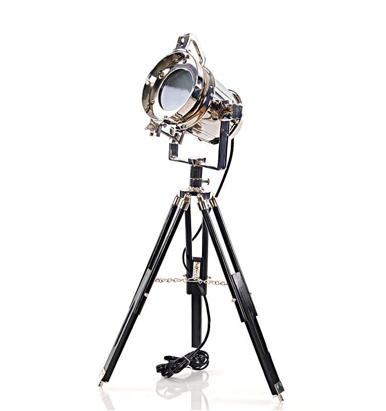 ALUM SPOT LIGHT ON WDN STAND BLK/NKL: ALUM SPOT LIGHT ON WDN STAND BLK/NKL -- The classic floor lamp spotlights your favorite accents in your office or living room. It pays homage to vintage nautical d?cor while staying true to its modern