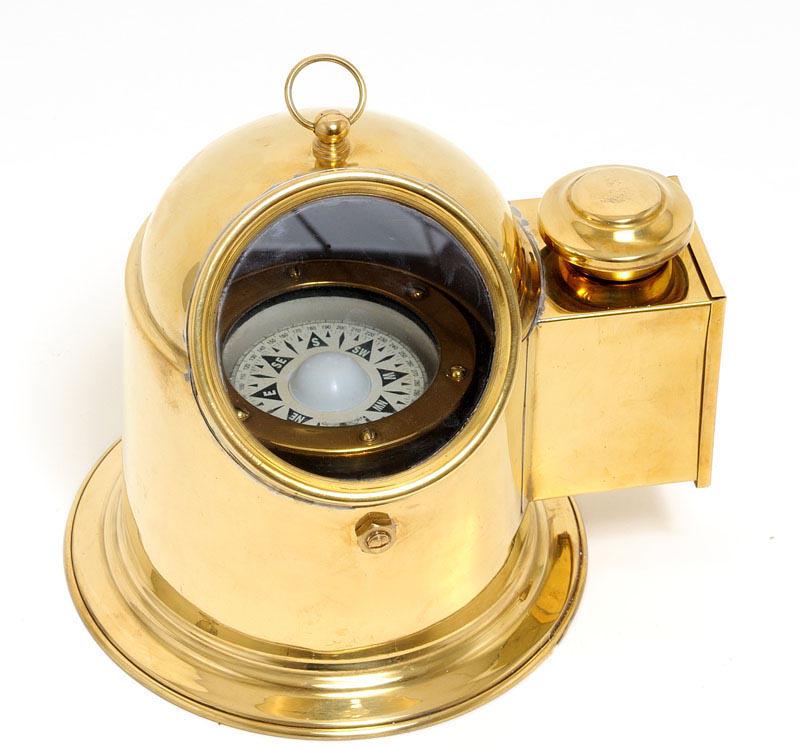Binnacle Compass: Binnacle Compass -- This is a fully functional Binnacle compass that was used to hold a ships magnetic compass. It is made of solid brass tinted with a golden glow. A floating dial compass is securely
