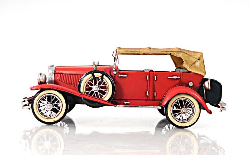 1934 RED DUESENBERG J 1:12: 1934 RED DUESENBERG J 1:12 -- DescriptionSwanky and stylish this red 1933 Duesenberg J model was handcrafted of iron. Scaled to size 1:12 this Duesenberg J is an exact replica of the original 1933 mod