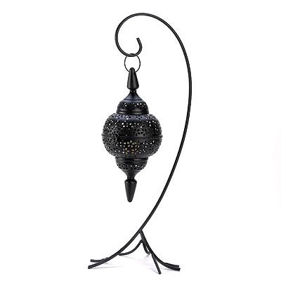 Black Lacy Cutout Floor Lantern: Black Lacy Cutout Floor Lantern **|**|** Inspired by Moroccan design, a candle lamp is suspended by a wrought iron curlicue floor stand, warming the area with a mystical glow. Weight 2 lbs. Iron. Cand