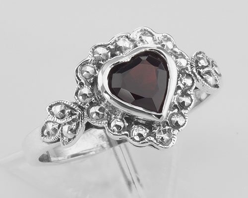 Heart Shaped Garnet Colored CZ Gemstone Ring - Sterling: Heart Shaped Garnet Colored CZ Gemstone Ring - Sterling **|**|** #R-950-G This beautiful Heart Shaped Garnet Colored CZ Ring is handcrafted and finished in intricate sterling silver detail. It feature