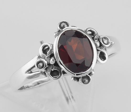 Cute 3/4 Carat Genuine Red Garnet and Marcasite Ring -: Cute 3/4 Carat Genuine Red Garnet and Marcasite Ring - **|**|** #R-392-G This cute Garnet Ring features a very nice center mounted Oval Faceted 3/4 Carat Garnet Gemstone surrounded by marcasites in cl