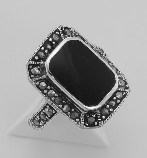 Onyx and Marcasite Ring - Sterling Silver: Onyx and Marcasite Ring - Sterling Silver **|**|** #R-27 Sterling Silver Onyx Ring with Marcasite Border is handcrafted and finished in intricate sterling silver detail. Onyx rings are timeless in sty