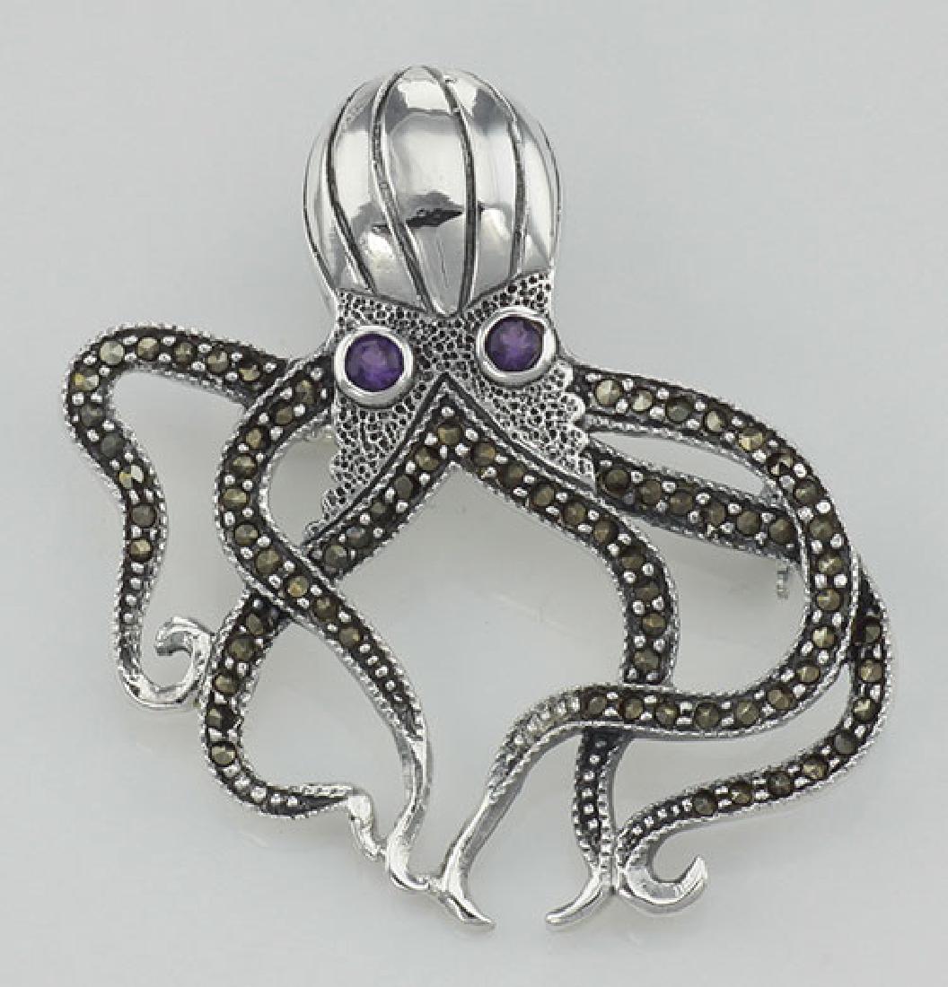 Marcasite / Amethyst Octopus Pin - Sterling Silver: Marcasite / Amethyst Octopus Pin - Sterling Silver **|**|** #P-142 Metal : Sterling Silver | Stone : Marcasite, Amethyst | Shape : Octopus | Style : Pin | Height : 1 3/4 inches | Width : 1 3/4 inches 
