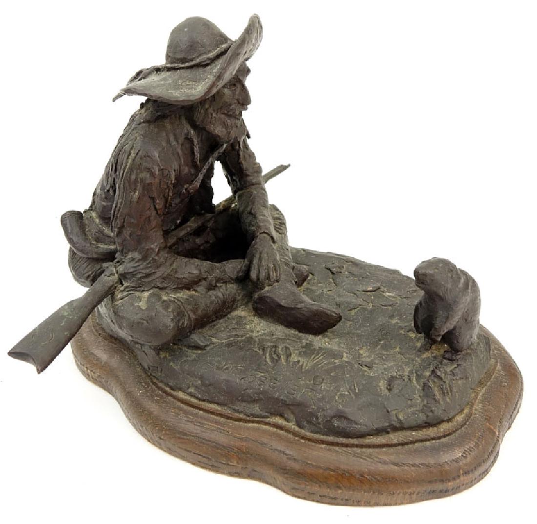 Joe Beeler, American (1931-2006) "Mountain Man and: Joe Beeler, American (1931-2006) "Mountain Man and Beaver" Bronze Sculpture on Wooden Base. Signed and numbered 8 of 30. Needs cleaning, wear to patina. Measures 7" H x 9" W, base measures 1" H. Shipp