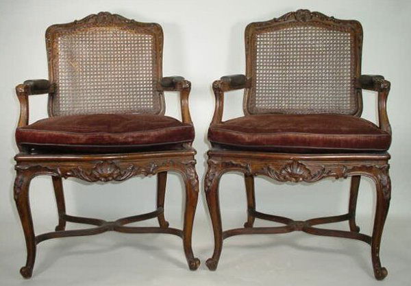 Antique Pair of Cane Back Chairs with Leather Seat: Antique Pair of Cane Back Chairs with Leather Seats and Leather Arm Rests. Unsigned. Separation on 25% of the Top Edge of Cane Back. Other Chair Minor Losses, Overall Good Condition or Better. Measure