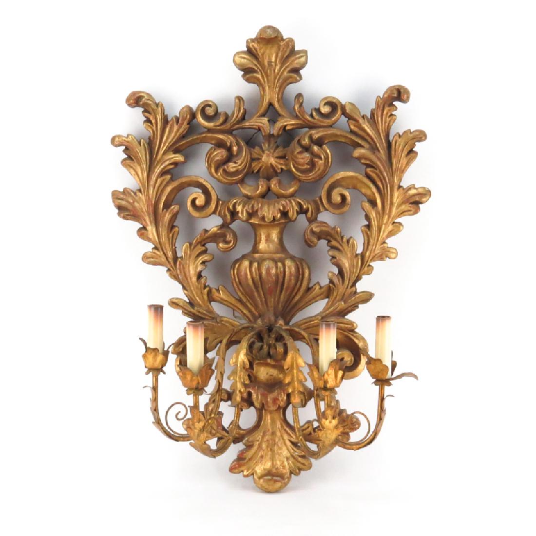 Baroque style Carved Gilt Wood and Gilt Tole Four Light: Baroque style Carved Gilt Wood and Gilt Tole Four Light Sconce. Unsigned. Minor rubbing otherwise good condition. Measures 26" H, 18" W. Shipping $135.00 (estimate $200-$400)