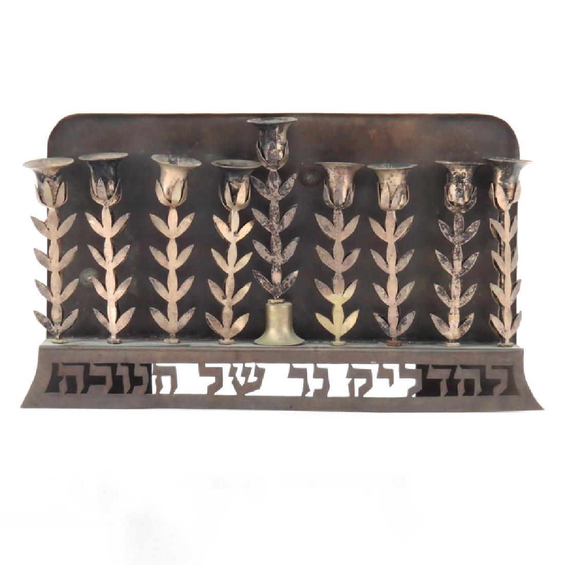 Vintage Judaica Floral Form Menorah. Unsigned. Wear and: Vintage Judaica Floral Form Menorah. Unsigned. Wear and in need of cleaning. Measures 7-1/4" H x 13" L. Shipping $61.00 (estimate $200-$300)