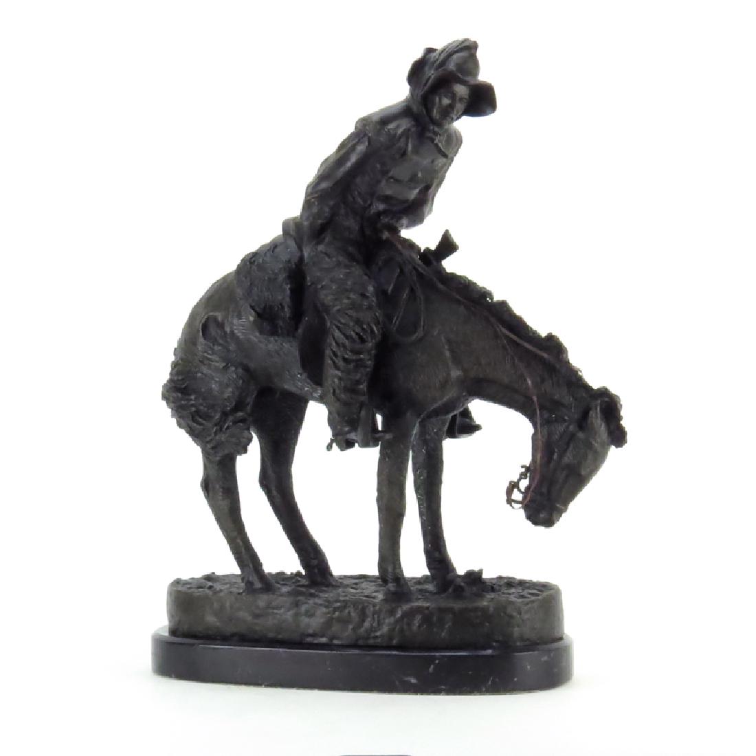 After: Frederic Remington, American (1861-1909) "The: After: Frederic Remington, American (1861-1909) "The Norther" Bronze Sculpture on Marble Base. Signed in cast. Some patina wear and rubbing. Measures 23" H x 18-1/2" W. Shipping: Third party. (estimat