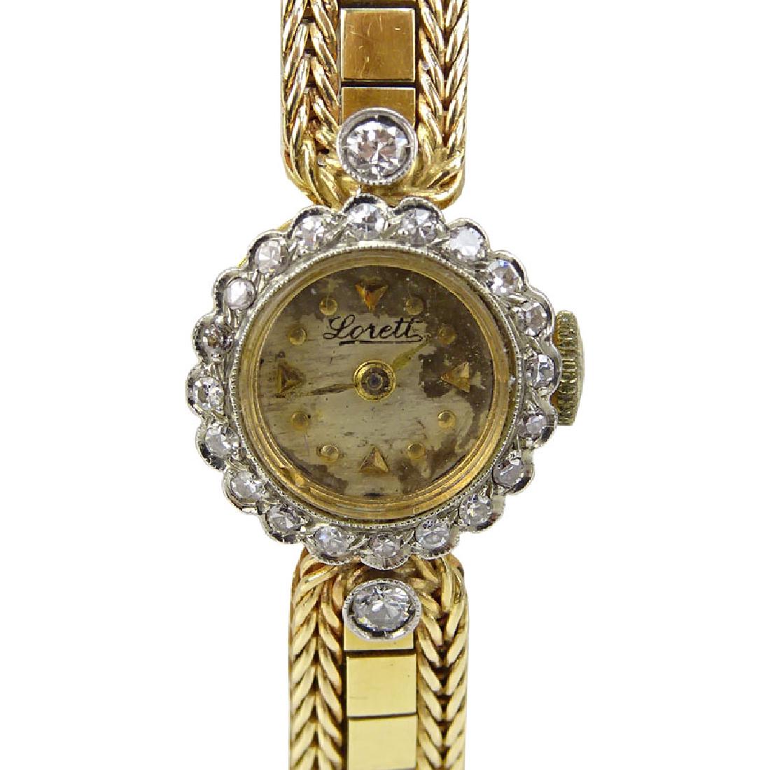Lady's Vintage Lorett 18 Karat Yellow Gold Bracelet: Lady's Vintage Lorett 18 Karat Yellow Gold Bracelet Watch with Diamond Bezel. Stamped 18K. Appears to be manual movement, not running. Wear to watch face. Please note the gallery does not warranty the
