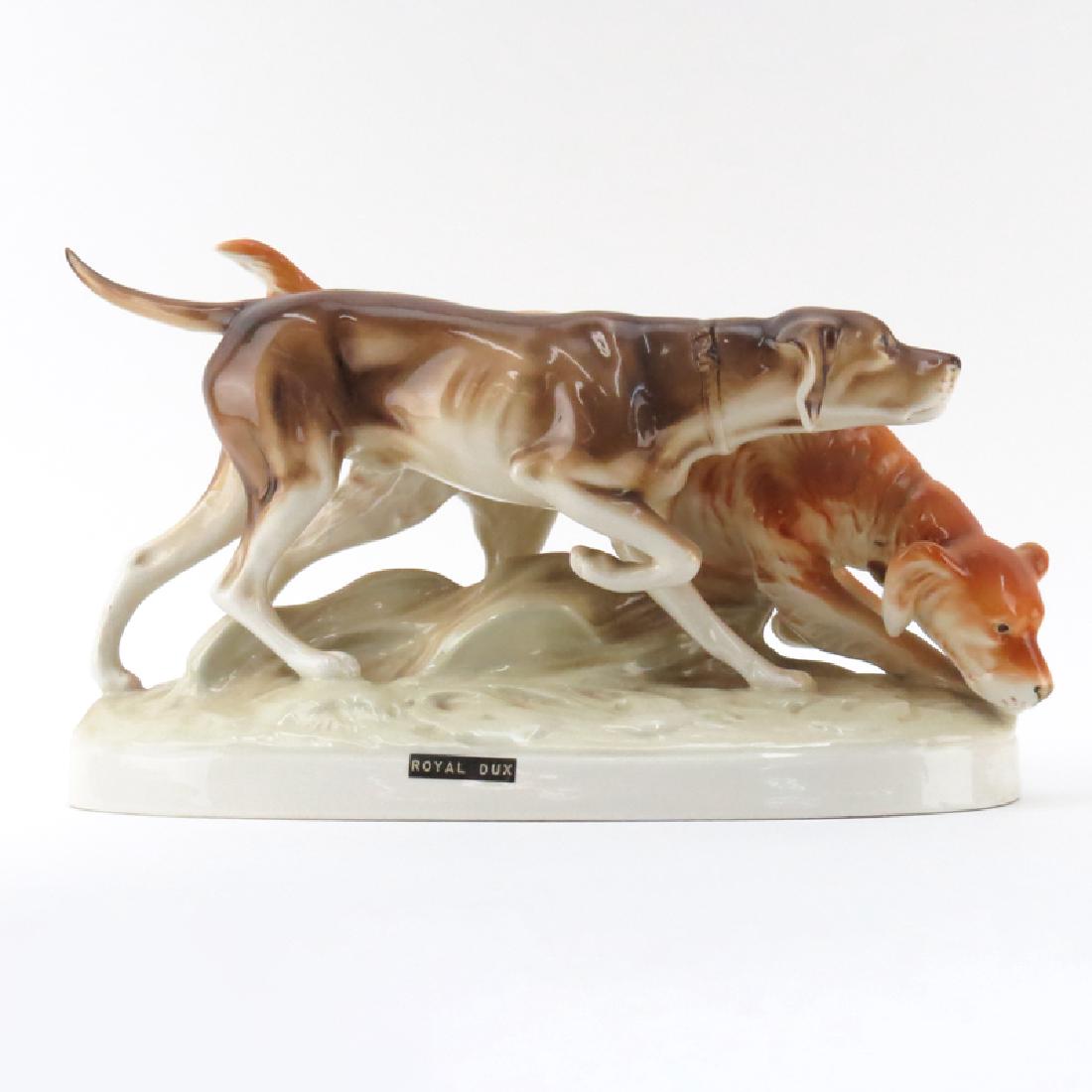 Royal Dux Porcelain Dog Group "Hunting Dogs". Signed.: Royal Dux Porcelain Dog Group "Hunting Dogs". Signed. Good condition. Measures 7-1/2" H x 16" L. Shipping: Third party. (estimate $100-$150)