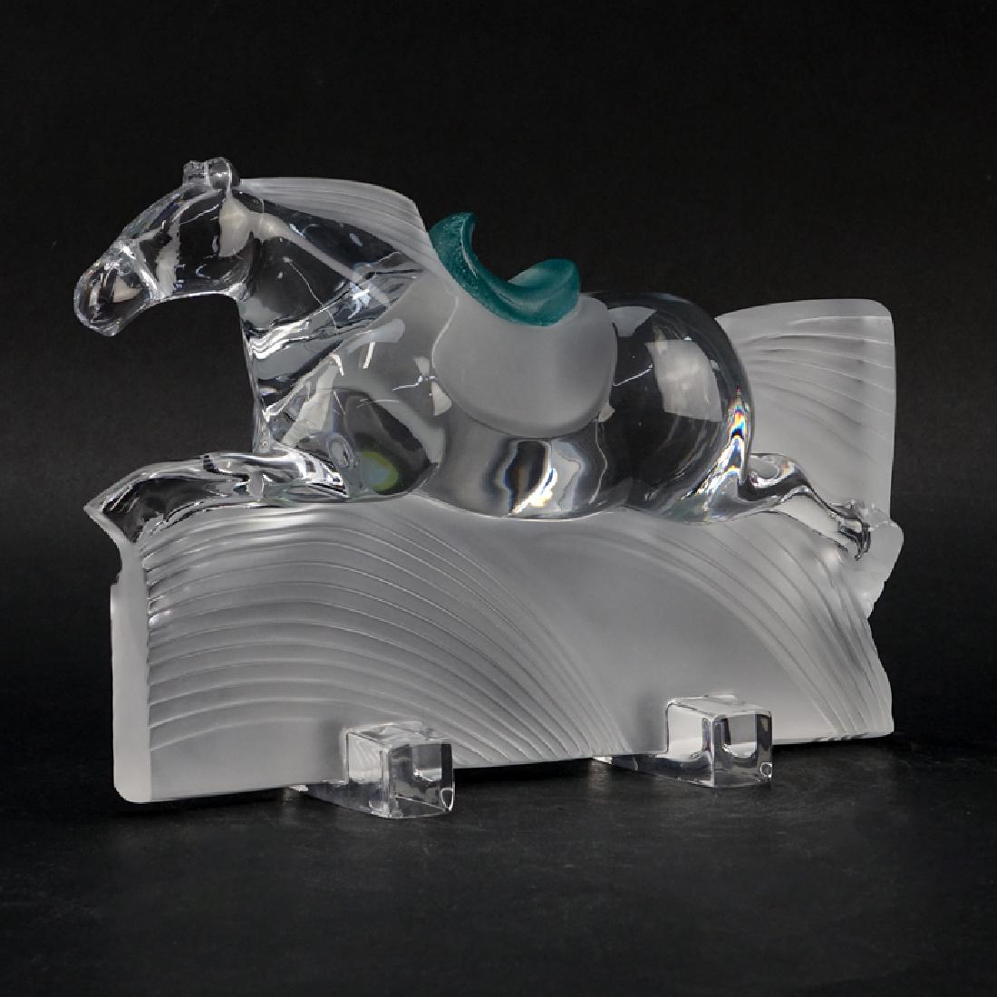 Daum France "Ming" Horse Sculpture. Frosted and clear: Daum France "Ming" Horse Sculpture. Frosted and clear crystal with molded green pate de verre saddle. Small repair to base/corner. Original receipt included. Measures 8" H x 11" W. Shipping $76.00 (es