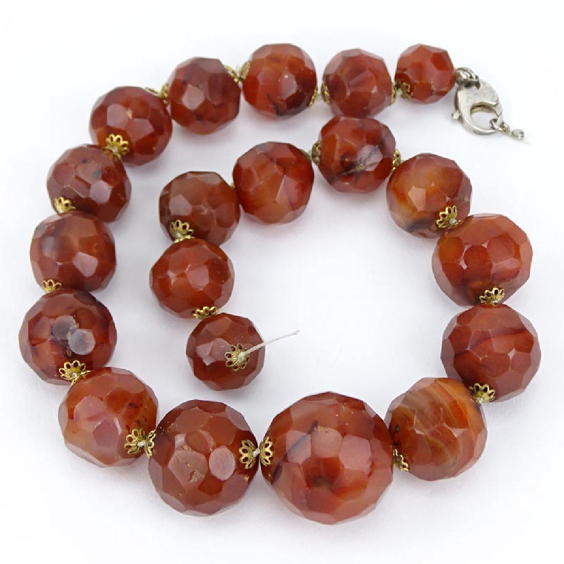 Vintage Syrian Graduated Faceted Red Agate Bead: Vintage Syrian Graduated Faceted Red Agate Bead Necklace. Unsigned. Needs small repair to clasp. Good condition. Beads measures 14.5mm to 27mm. Measures 17-1/2" L. Approx. weight: 217.6 grams. Shippin