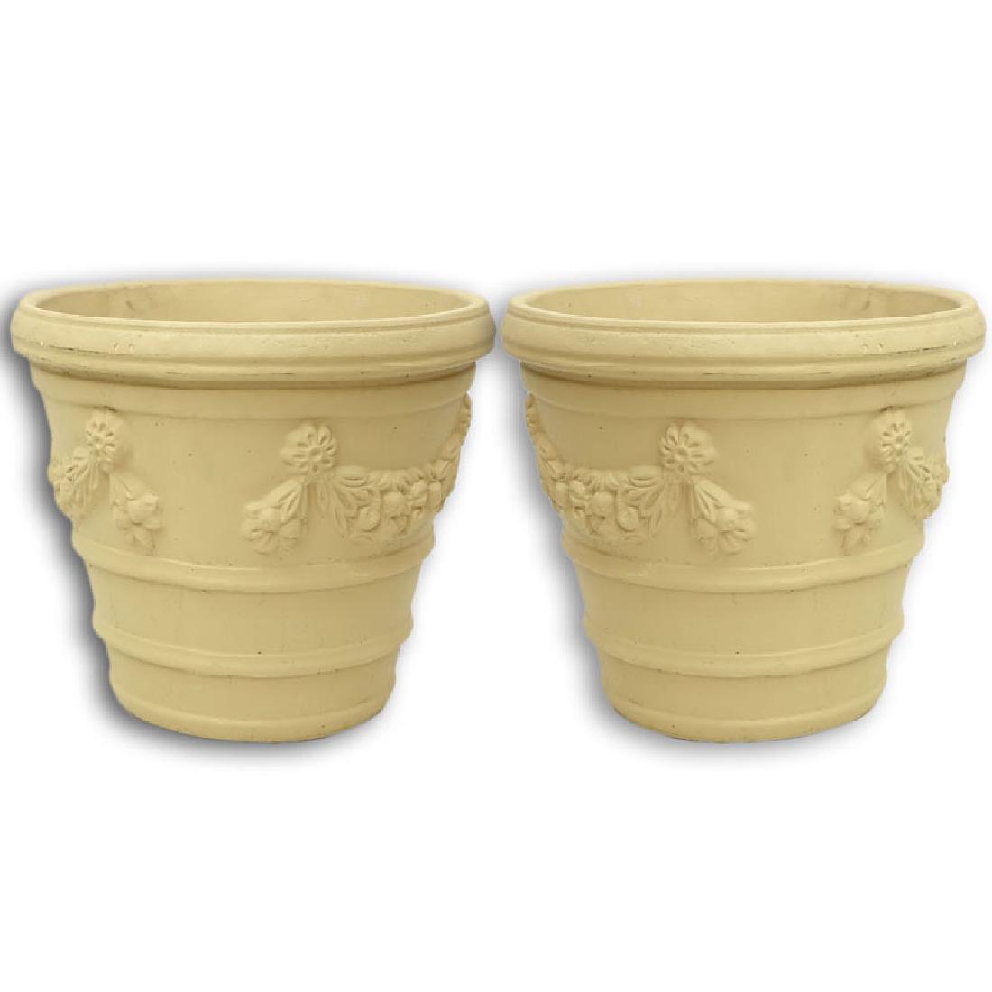 Pair of Italian Style Painted Cast Faux Stone Planter.: Pair of Italian Style Painted Cast Faux Stone Planter. Raised garland and rosettes relief. Natural wear and rubbing otherwise, residue otherwise good condition. Measures 21" H x 23" W. Provenance: Col