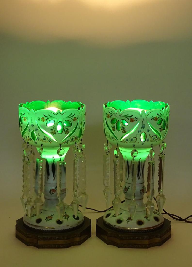 Pair of 20th Century Bohemian Glass Lusters.: Pair of 20th Century Bohemian Glass Lusters. Electrified and with bronze bases. Unsigned. Minor chips to pendants, rubbing to gilt decoration otherwise good condition. Measure 13-1/4 Inches Tall and 7