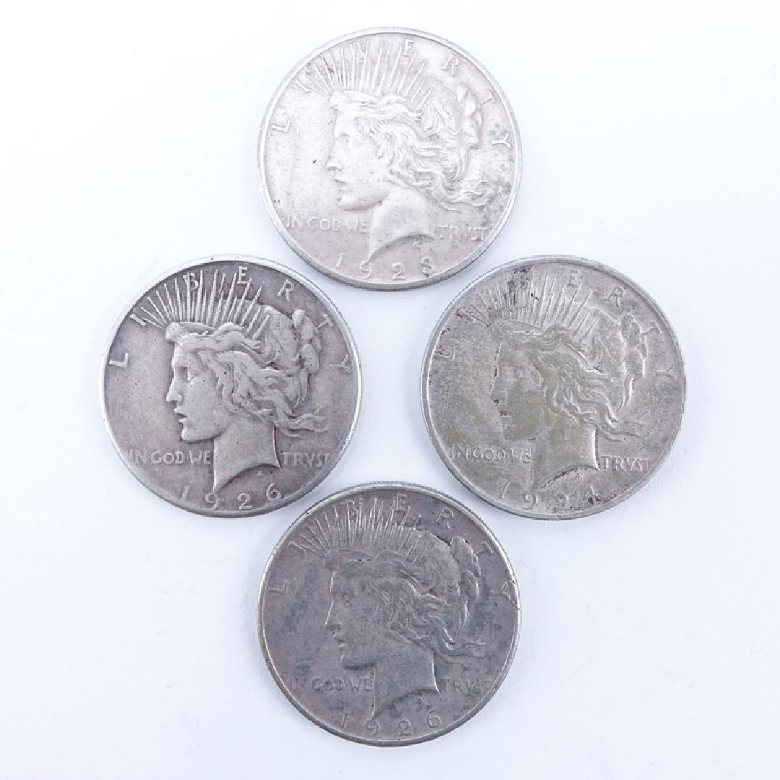 Collection of Four (4) U.S. Peace Dollars. Designer (1 of 2)