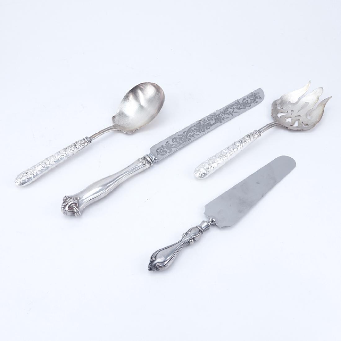Collection of Four (4) Sterling Handled Tableware. (1 of 5)