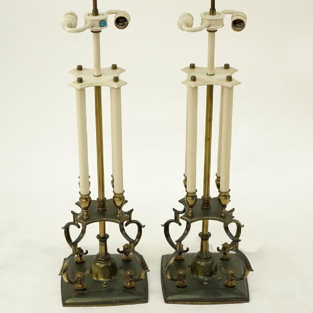 Mid-Century Modern Pair of Lamps in Brass by Designer: Mid-Century Modern Pair of Lamps in Brass by Designer Tommi Parzinger for Stiffel. Original label. Wear to finish, bend to one top rod, missing a finial at base. Measures 37" to top of finial. Shippin