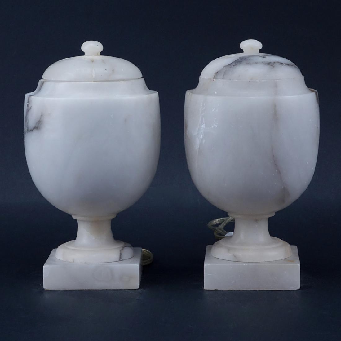 Pair of Alabaster Covered Lamps. Repair to one cover,: Pair of Alabaster Covered Lamps. Repair to one cover, nicks, and scuffs. Measures 9-3/4" H. Shipping: Third party. (estimate $50-$100)