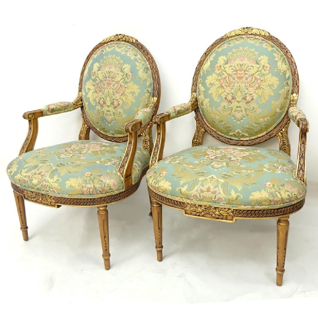 Pair of Karges Carved Parcel Gilt Wood Upholstered: Pair of Karges Carved Parcel Gilt Wood Upholstered Louis XIV Style Fauteuils. Manufactured by Karges Furniture Company, Evansville, Indiana. Signed. Good condition. Measures 40-1/2" H x 28" W x 23" D.