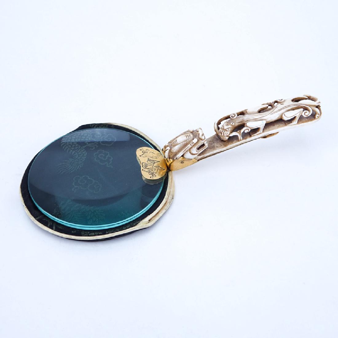 Early 20th Century Chinese Magnifying Glass with Carved: Early 20th Century Chinese Magnifying Glass with Carved Bone and Brass Belt Buckle Handle. Unmarked. Good condition. Measures 9" L. We Will Not Ship This Item Out of State of Florida. Anyone Having Th