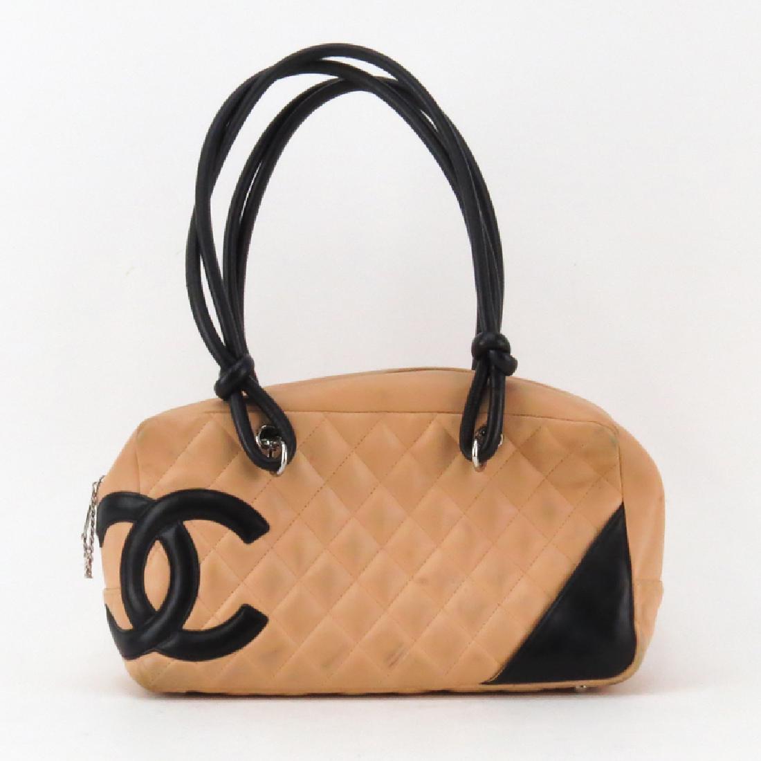 Chanel Linge Cambon Quilted Leather Bowler Bag: Chanel Linge Cambon Quilted Leather Bowler Bag. Features the CC logo on the corner and double-strand knotted shoulder straps. The inside has black CC signature textile lining. Zipper and slot pockets 