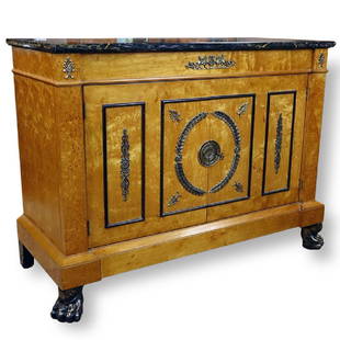 In the Manner of Georges Jacob French Empire Style: In the Manner of Georges Jacob French Empire Style Bronze Mounted Marble Top Commode. Has two doors and stands on lion paw front feet. Key included. Normal rubbing, some scuffs to feet. Measures 36" H