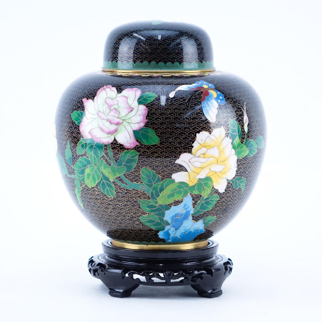 20th Century Chinese Black and Floral CloisonnÃ© Ginger: 20th Century Chinese Black and Floral CloisonnÃ© Ginger Jar on Wooden Stand. Minor rubbing to enamel. Measures 9-1/2" H, measures 11" H with stand. Shipping $68.00 (estimate $50-$100)