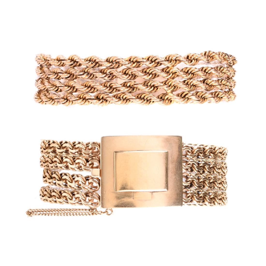 Two (2) Vintage Heavy 14 Karat Yellow Gold Multi-strand: Two (2) Vintage Heavy 14 Karat Yellow Gold Multi-strand Link Bracelets. One stamped 14K. Good vintage condition. Wider measures 7-1/4" L, 1" W. Approx. weight: 109.2 grams. Shipping $32.00 (estimate $