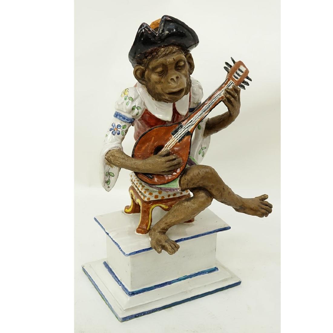 Italian Faience Pottery Figurine, Monkey Musical: Italian Faience Pottery Figurine, Monkey Musical Player. Signed and numbered to base. Small repair to toe on one foot otherwise typical rubbing and dripping to glaze good condition. Measures 15" H x 8