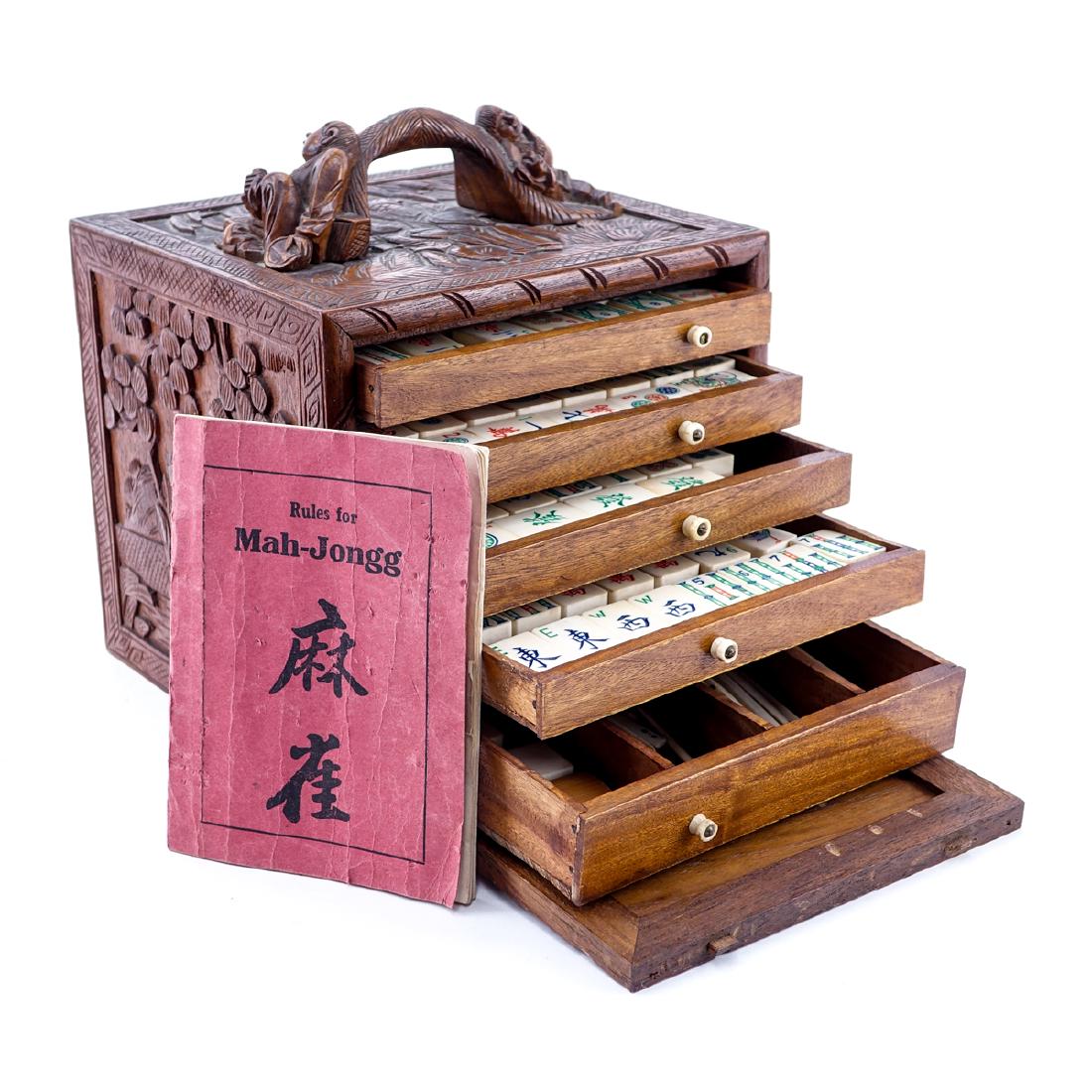 Vintage Mahjong Set, Carved Teak Box with Carved and: Vintage Mahjong Set, Carved Teak Box with Carved and Polychrome Bone and Bamboo Tiles. Appears to be compete. Good condition. Box measures 7-3/8" H, 7-3/8" W. Shipping $85.00 (estimate $200-$300)