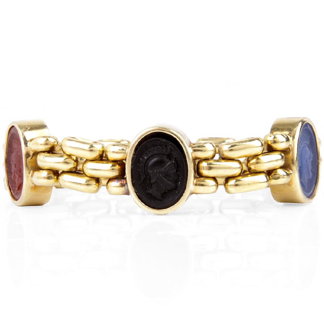 Vintage 18K Gold and Intaglio Bracelet: Vintage 18 Karat Yellow Gold and Carved Intaglio Link Bracelet. Signed (illegible), stamped 750 (rubbed). Measures 7" L, 5/8" W. Approx. weight: 32.2 grams.
