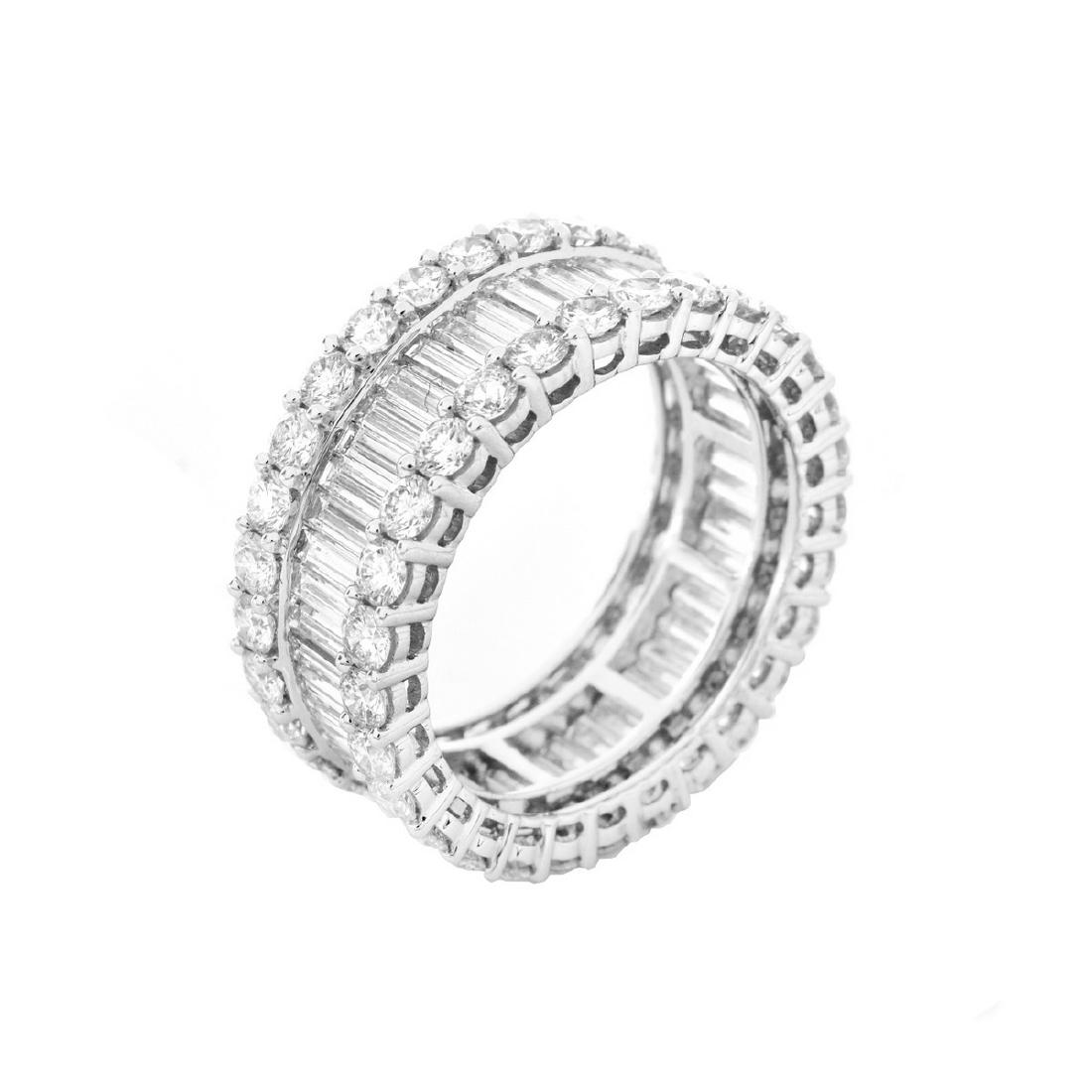 Diamond and 18K Gold Eternity Band: Approx. 6.10 Carat Baguette and Round Brilliant Cut Diamond and 18 Karat White Gold Eternity Band. Diamonds G color, VS clarity. Stamped 18K. Ring size 6-1/2. Approx. weight: 5.9 grams. Domestic Shipp
